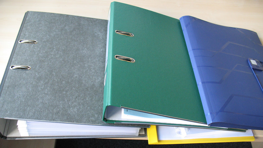 Various folders on the work table.
